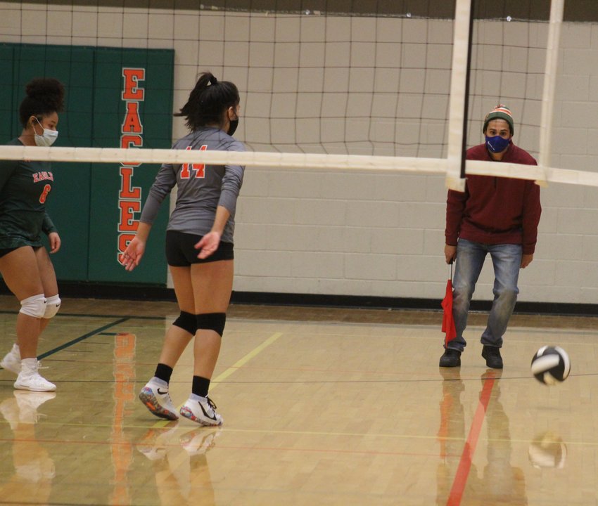 The Eagles’ Lesly Tevill (14) and Mya Spencer (left) have a good view of this serve sailing out of bounds during a match against Brighton April 15.